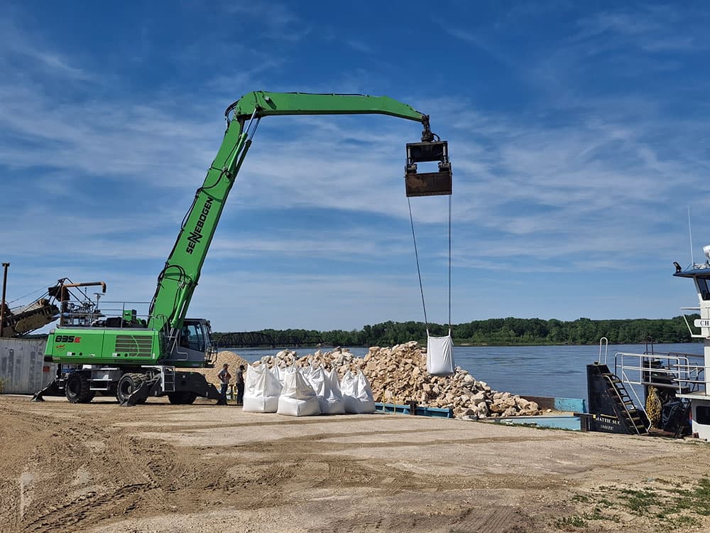 Crane Lifting bags of rock