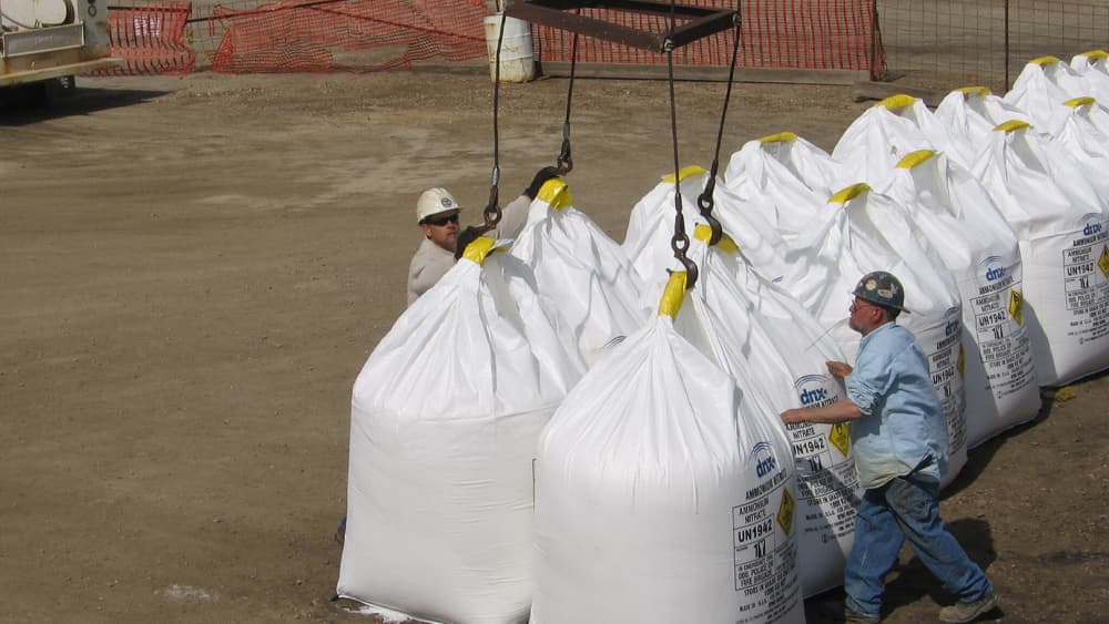 Wayne B. Smith workers unhooking bags