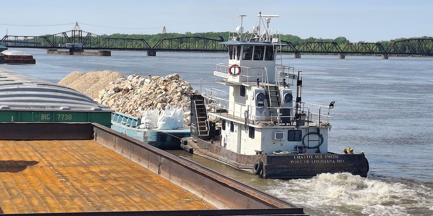River barge hauling rock