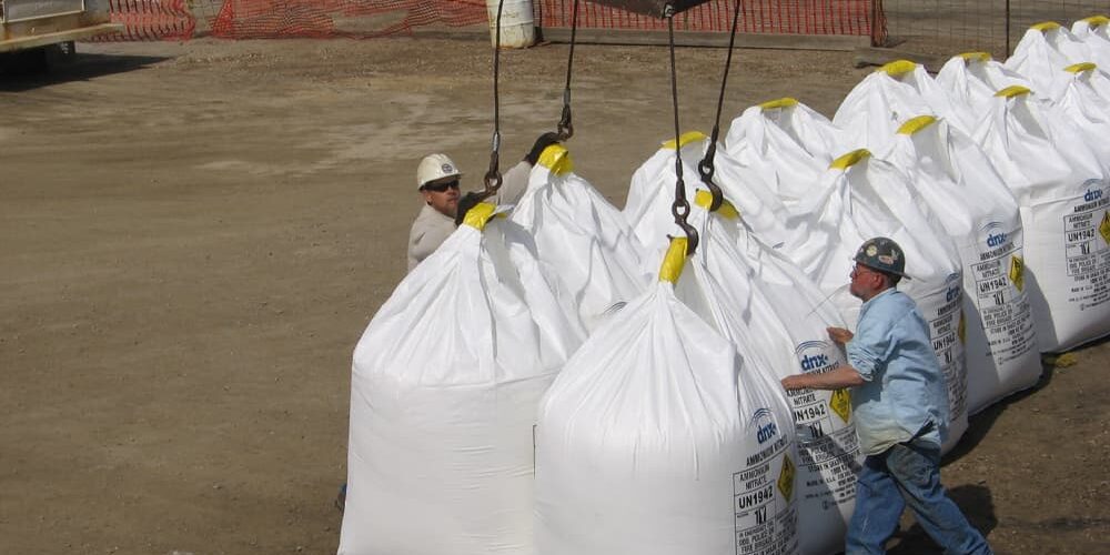 Wayne B. Smith workers unhooking bags